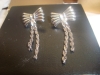 Dangling Silver Bow Earrings